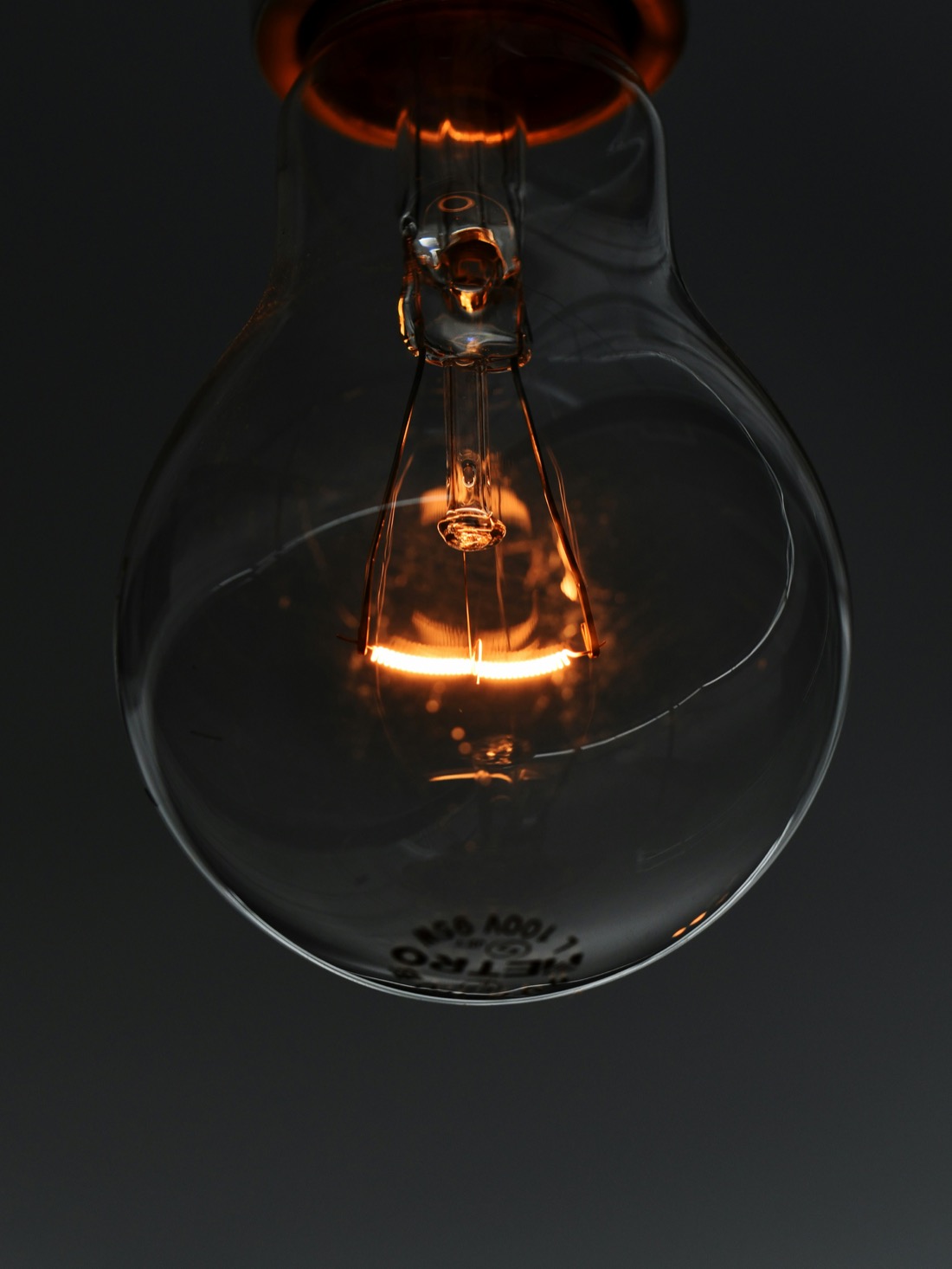 A glowing incandescent lightbulb filament